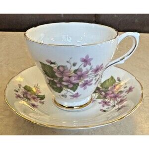 ROYAL SUTHERLAND  FOOTED TEA CUP & SAUCER PURPLE VIOLETS GOLD TRIM ENGLAND